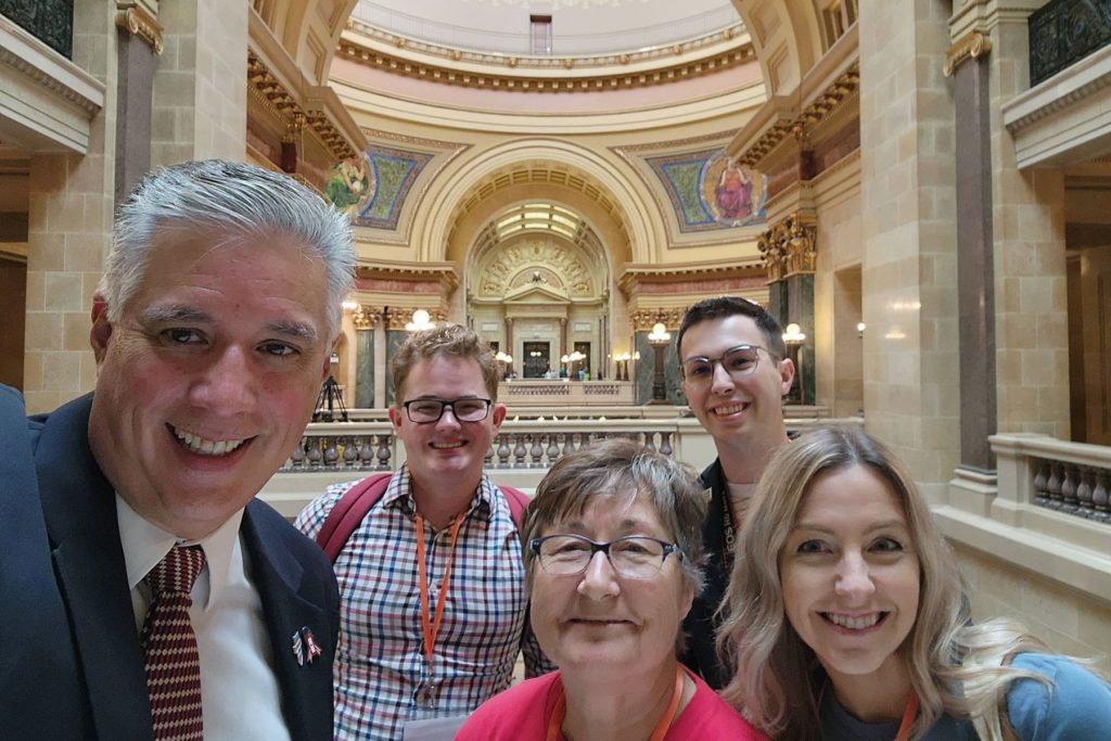 Selfie of five people taken inside the Wisconsin Capital Building