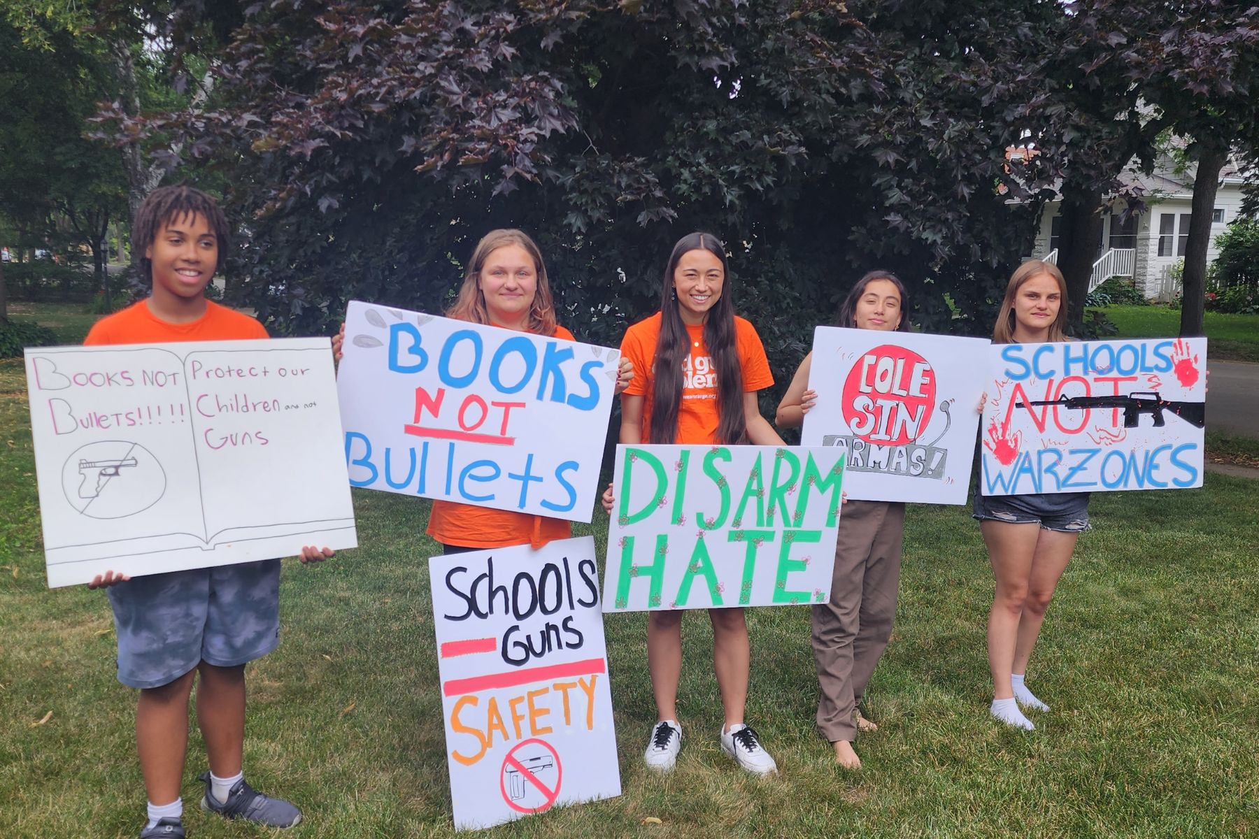 Five youth interns help prepare for a gun violence prevention rally