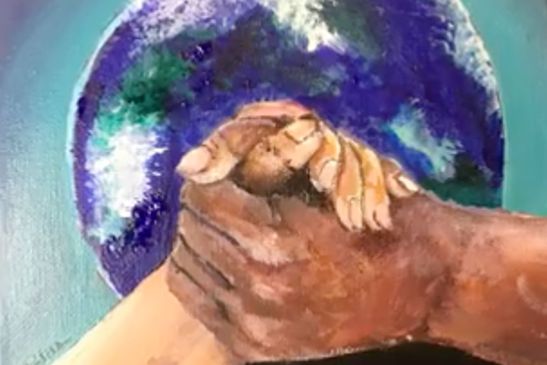 Two hands with different skin tones are clasped together. Behind the hands is an image of the world.