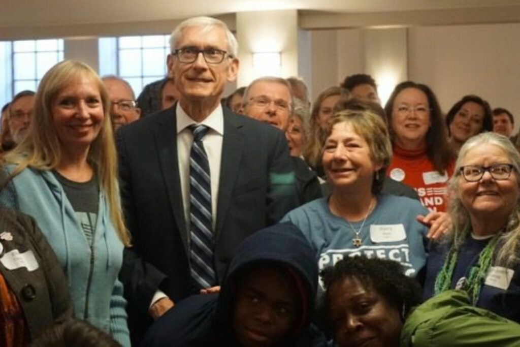 Governor Tony Evers poses with a group of WAVE supporters during the 2019 WAVE Day of Action