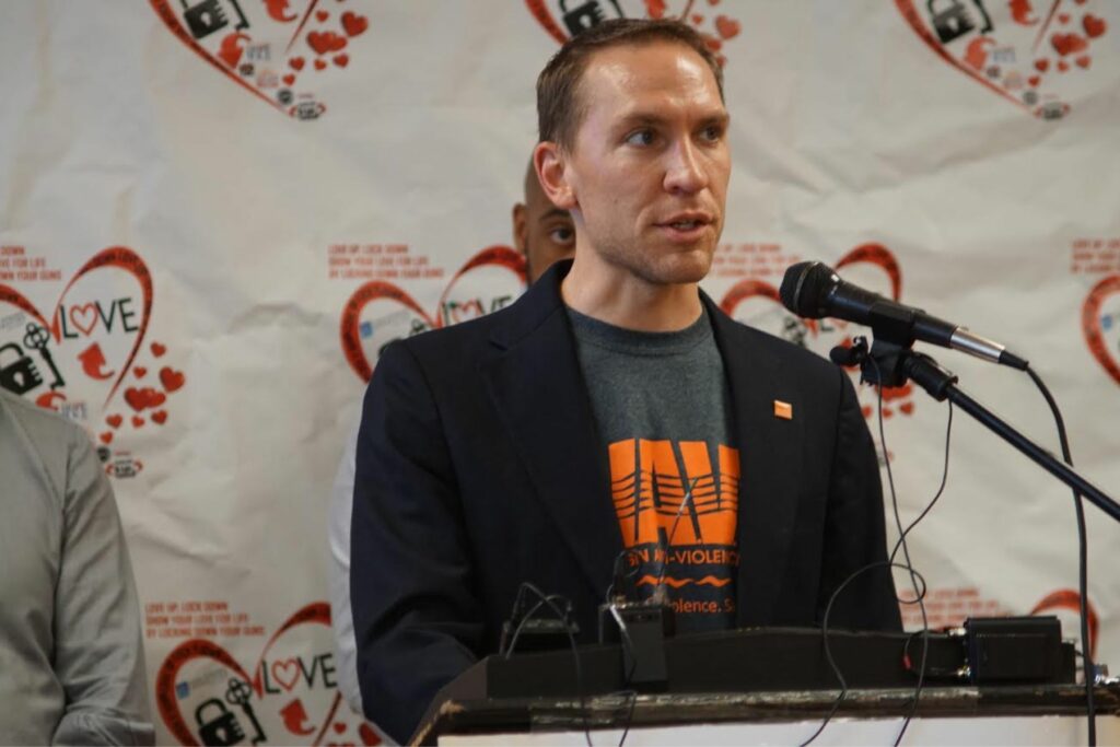 State Senator Chris Larson Speask at Impacted Lives in 2019. He wears a WAVE tshirt.