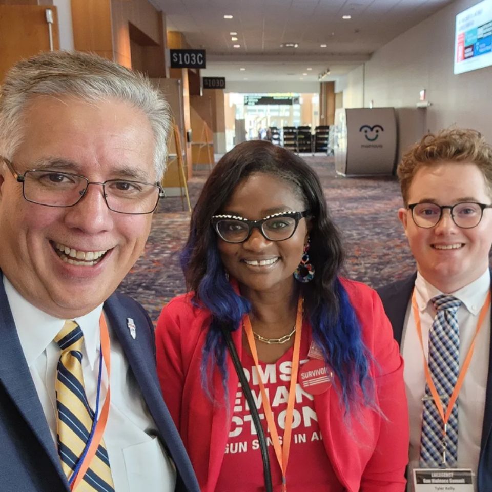 Three people are gathered together for a selfie.